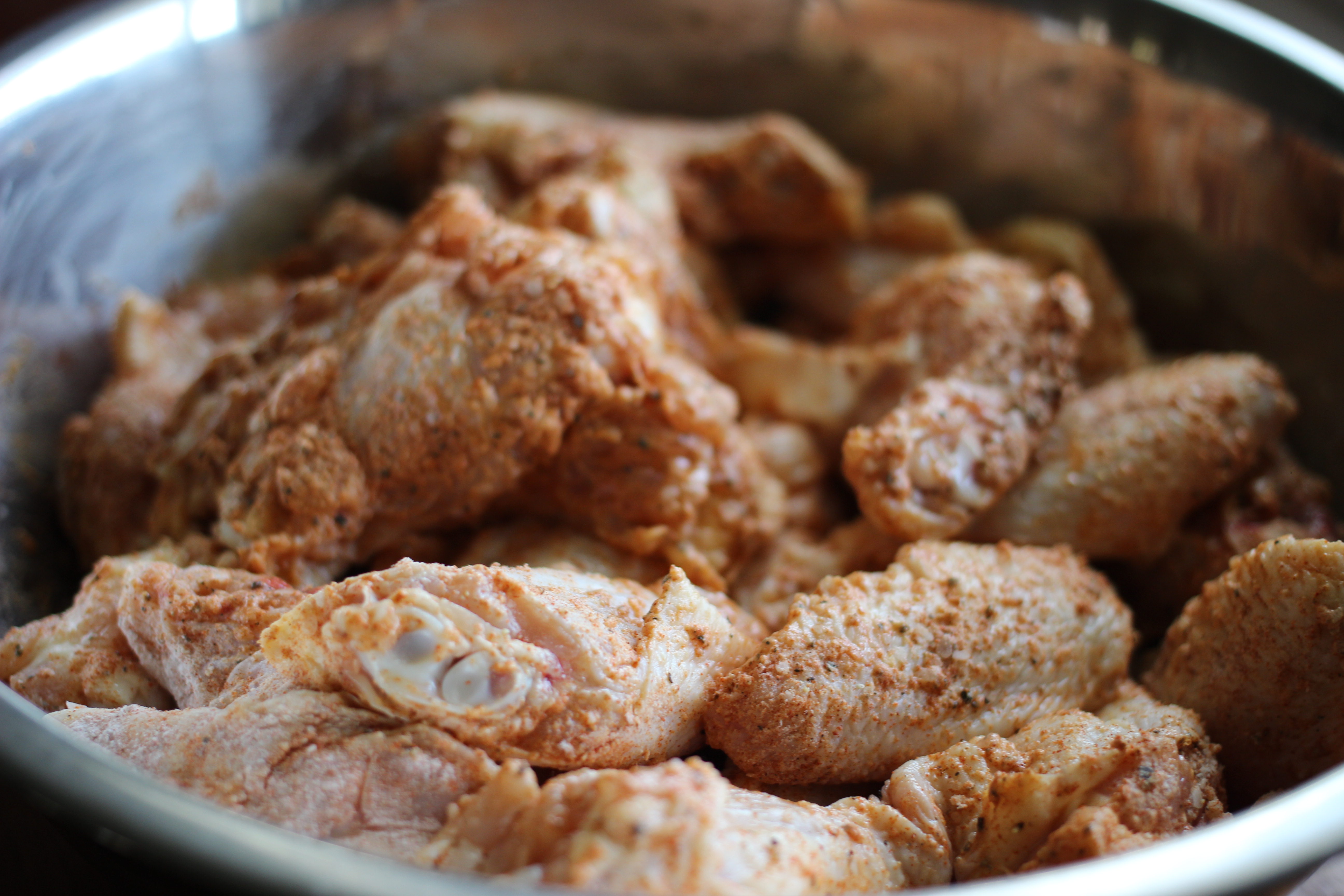 Wings broken down and coated, ready for the oven.